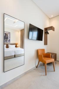 TV i/ili multimedijalni sistem u objektu Hotel El Toro Tanger