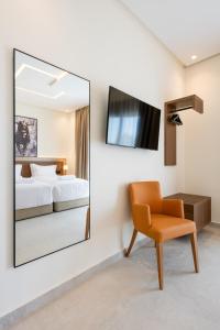 TV i/ili multimedijalni sistem u objektu Hotel El Toro Tanger