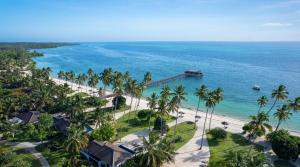 an aerial view of a beach with palm trees at The Residence Zanzibar in Kizimkazi