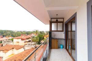 a balcony with a view of a city at Casa Quina Heritage#5 in Taleigao