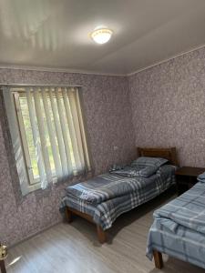 Katil atau katil-katil dalam bilik di Guest House Sevan 2