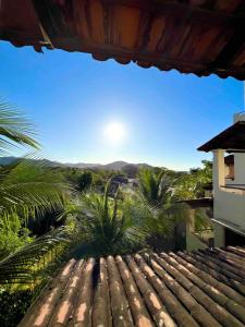a view from the roof of a house with palm trees at Stylish & Comfortable Condo with Balconies in Coco