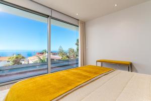 Ένα ή περισσότερα κρεβάτια σε δωμάτιο στο El Dourado House