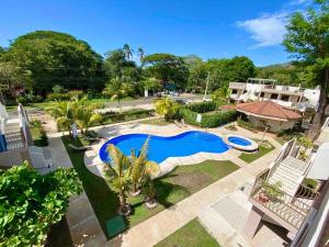 an overhead view of a swimming pool in a yard at Sun and Waves Getaway in Coco
