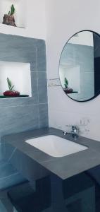 a bathroom with a mirror and a sink at Anna homestay- Đông Tác, Tuy Hoà, Phú Yên in Ðông Tác (1)