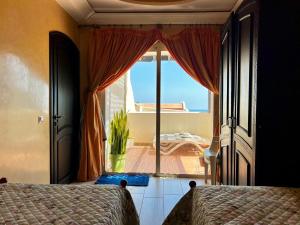 Ένα ή περισσότερα κρεβάτια σε δωμάτιο στο Appartement vue sur mer