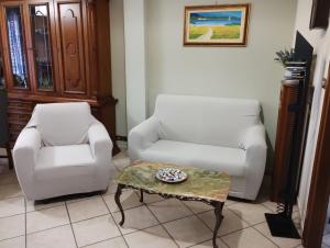 A seating area at La casa di Valentino - grazioso ed ampio bilocale
