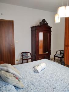 A bed or beds in a room at La casa di Valentino - grazioso ed ampio bilocale