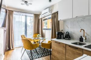 Kuchyň nebo kuchyňský kout v ubytování Aparthome Tatra