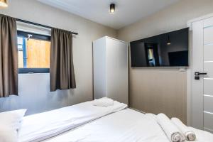 Postel nebo postele na pokoji v ubytování Aparthome Tatra