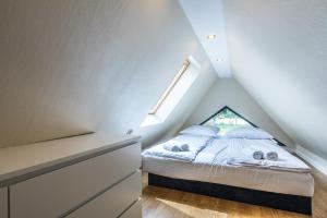 Postel nebo postele na pokoji v ubytování Aparthome Tatra