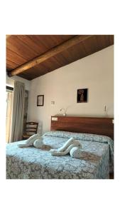 Postel nebo postele na pokoji v ubytování Il Sogno di Teresa