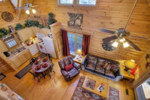 an overhead view of a living room and kitchen in a log cabin at Gorgeous Cabin Hot Tub, Fireplace, Great Location in Sevierville