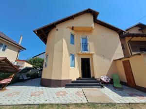 a large house with stairs and a door at Casa Vlad in Costinesti