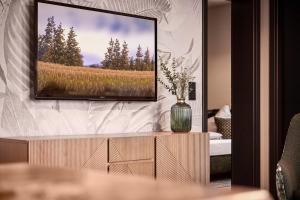 Un televizor și/sau centru de divertisment la Villa EDELWEISS de luxe inkl Wellness-Spa und MeineCardPLus