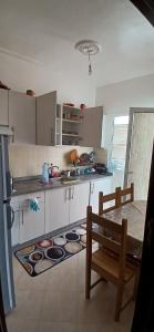 a kitchen with a table and a counter top at RELAX IBN BATOUTA in Tangier