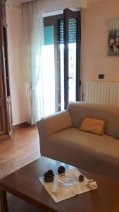 a living room with a couch and a coffee table at Roses house in Porto San Giorgio +22 photos