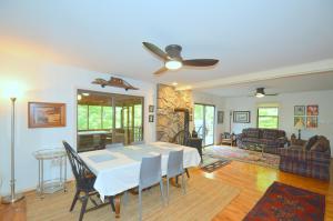 a dining room with a table and chairs in a living room at Ahh ... Riverwood in Morton Grove