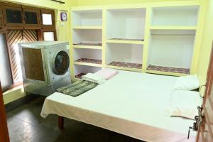Voodi või voodid majutusasutuse Sandhya Guest House toas