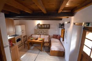 a living room with a couch and a table at Milonas Guest House in Monemvasia