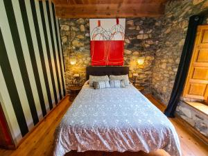 Postel nebo postele na pokoji v ubytování El Molino de la Ropería