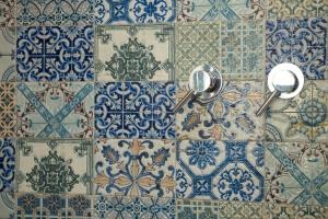 a bunch of blue and white tiles on a wall at Vittoria Chianti Vacations in Poggibonsi +167 photos