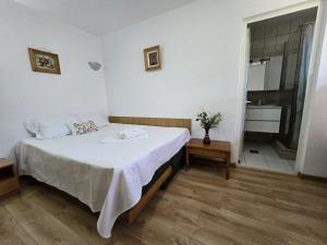 Postel nebo postele na pokoji v ubytování Vila Eliade