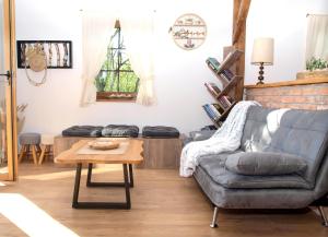 a living room with a couch and a coffee table at Relax house Aurora in Jasenovica