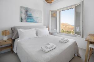 Postel nebo postele na pokoji v ubytování Infinity View Villa Agios Ioannis Serifos