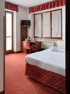 Postel nebo postele na pokoji v ubytování Fell Hotel
