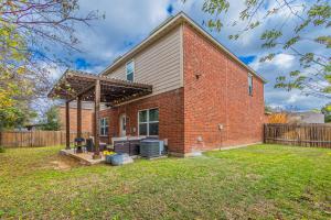 a brick house with a grill in a yard at Luxury 5BR Dallas Retreat with Business Amenities - Perfect for Business Travelers, Families & Groups in Dallas