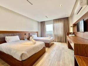 Letto o letti in una camera di Gaia Pyramids View INN