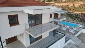 an aerial view of a house with a swimming pool at Villa Panorama - Private heated pool and jacuzzi with ocean view in Ivanica