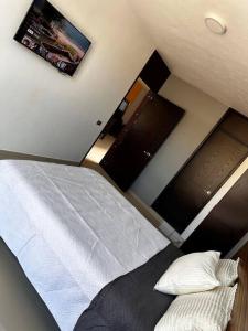 Ein Bett oder Betten in einem Zimmer der Unterkunft Casa Cómoda
