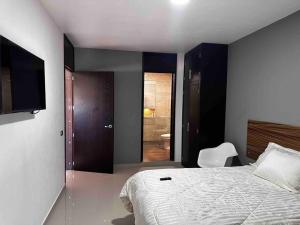 Ein Bett oder Betten in einem Zimmer der Unterkunft Casa Cómoda
