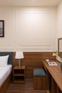 Voodi või voodid majutusasutuse Lumina Hotel Da Lat Central toas