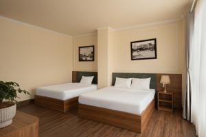 Voodi või voodid majutusasutuse Lumina Hotel Da Lat Central toas
