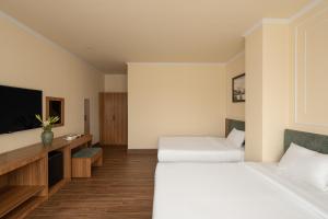 Voodi või voodid majutusasutuse Lumina Hotel Da Lat Central toas
