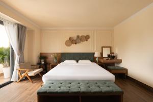 Voodi või voodid majutusasutuse Lumina Hotel Da Lat Central toas