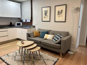 a living room with a couch and a table at Loft in Uribarri in Bilbao