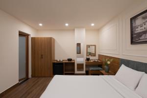 Voodi või voodid majutusasutuse Lumina Hotel Da Lat Central toas
