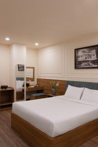 Voodi või voodid majutusasutuse Lumina Hotel Da Lat Central toas