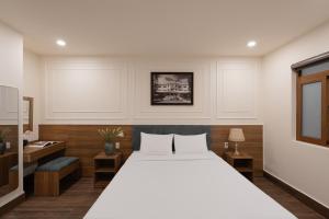 Voodi või voodid majutusasutuse Lumina Hotel Da Lat Central toas
