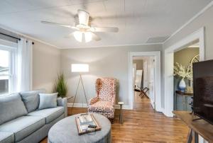 a living room with a couch and a ceiling fan at Southern Charm Cottage in Hickory