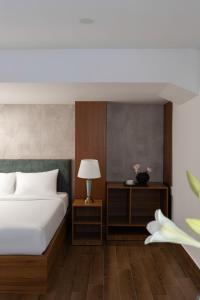 Voodi või voodid majutusasutuse Lumina Hotel Da Lat Central toas