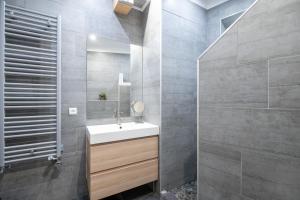 a bathroom with a white sink and a shower at "Le Zen" by EnjoyNice, central spacious apartment with Airco, beach at 10 min in Nice +36 photos