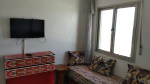 TV a/nebo společenská místnost v ubytování Hotel Al Andalous