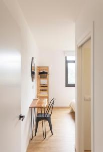 a dining room with a table and a chair at Casa Candales - Consuelo in Cedeira +21 photos