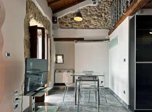 TV a/nebo společenská místnost v ubytování Loft Naevio + 7 fotografií