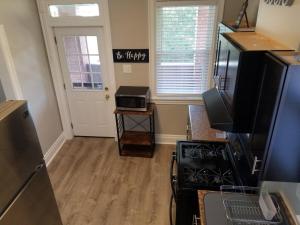 a kitchen with a stove and a microwave at Private 3 Bdrm Apt Spacious And Convenient in Pittsburgh +11 photos